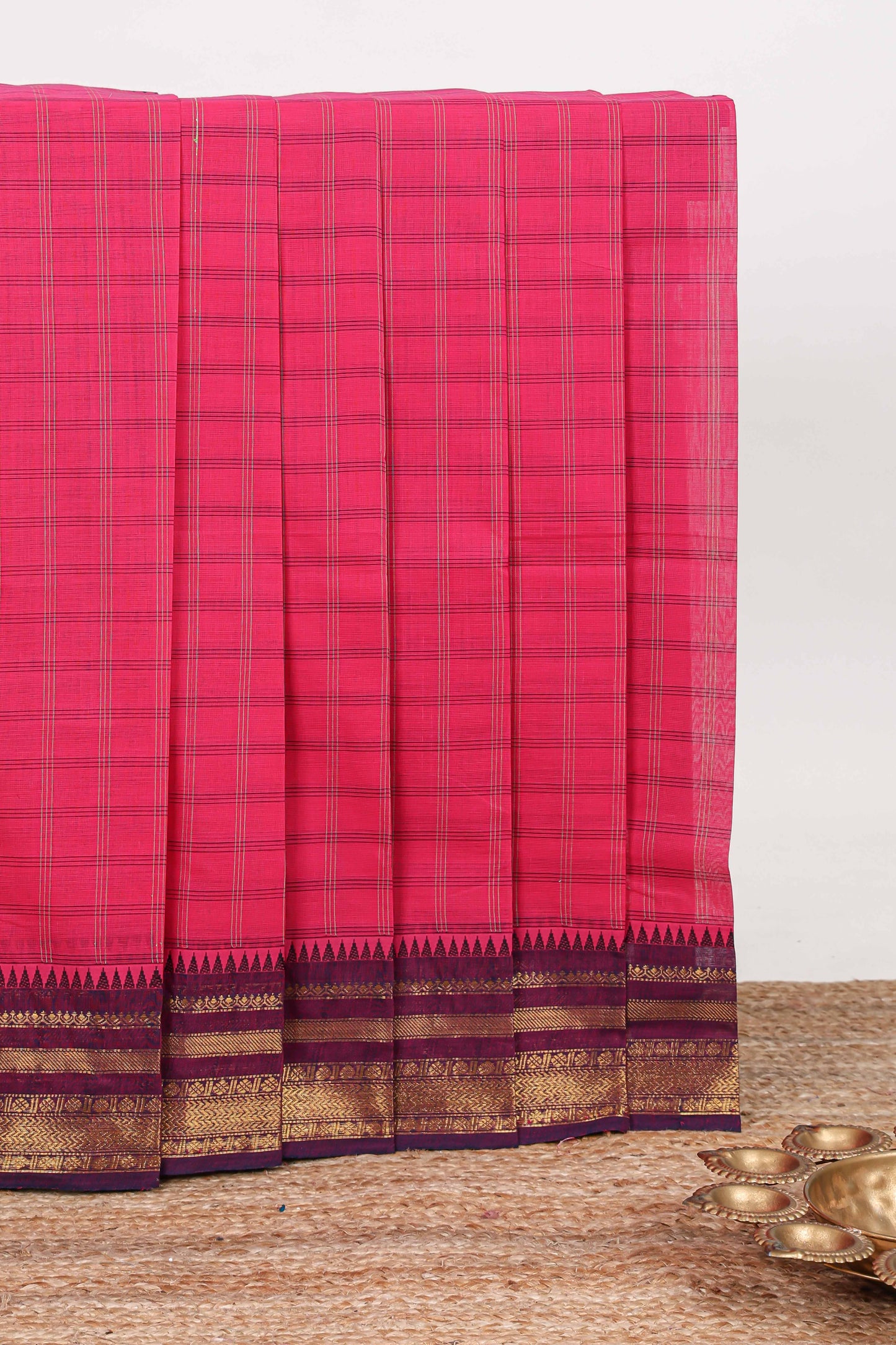 Pink checked chettinad cotton saree with contrast zari border and matching striped pallu