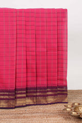 Pink checked chettinad cotton saree with contrast zari border and matching striped pallu