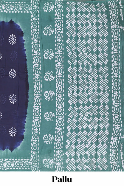 Blue batik print floral butta sungudi cotton saree with contrast border and pallu