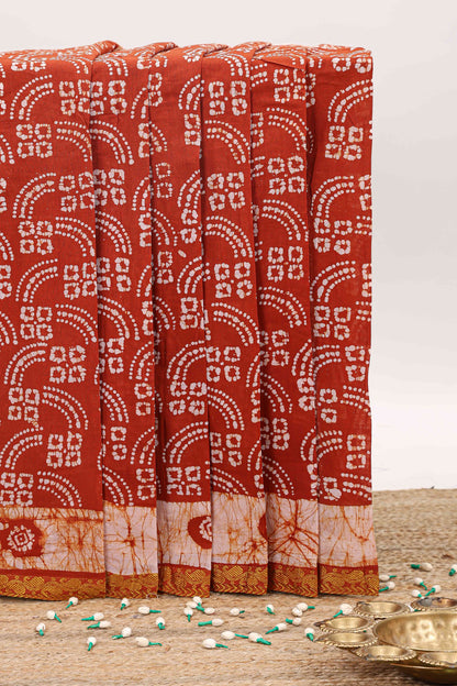 Brick red bandhini style sungudi cotton saree with contrast border and matching pallu