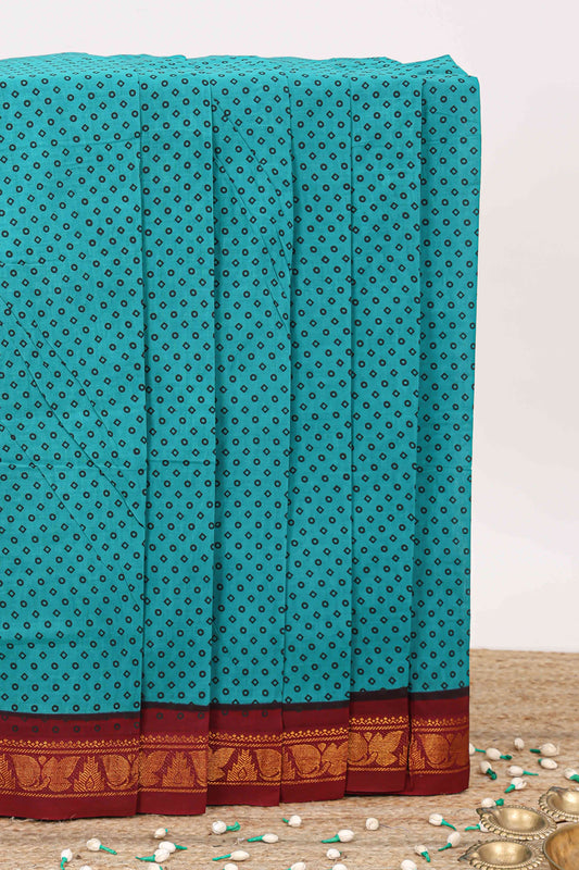 Turquoise green small butta sungudi cotton saree with contrast zari border and striped pallu