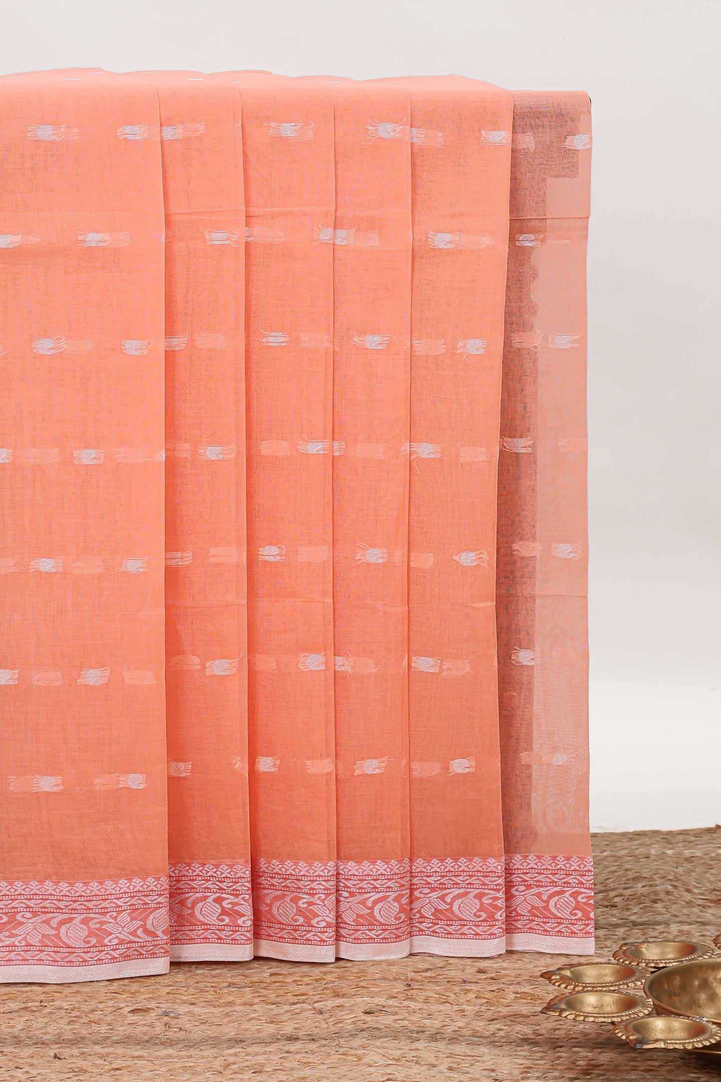 Soft peach butta design bengal cotton saree with self border and matching striped pallu