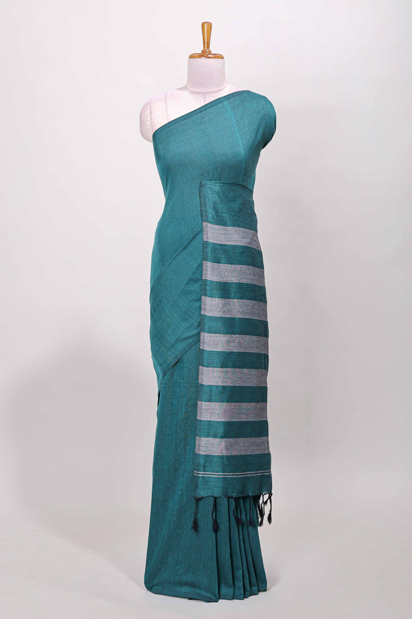 Borderless green plain south cotton saree with contrast striped pallu and matching blouse