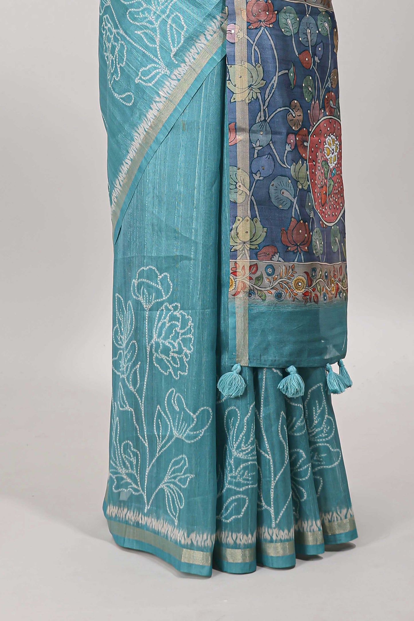 Turquoise green floral design art tussar saree with self zari border and contrast floral print pallu