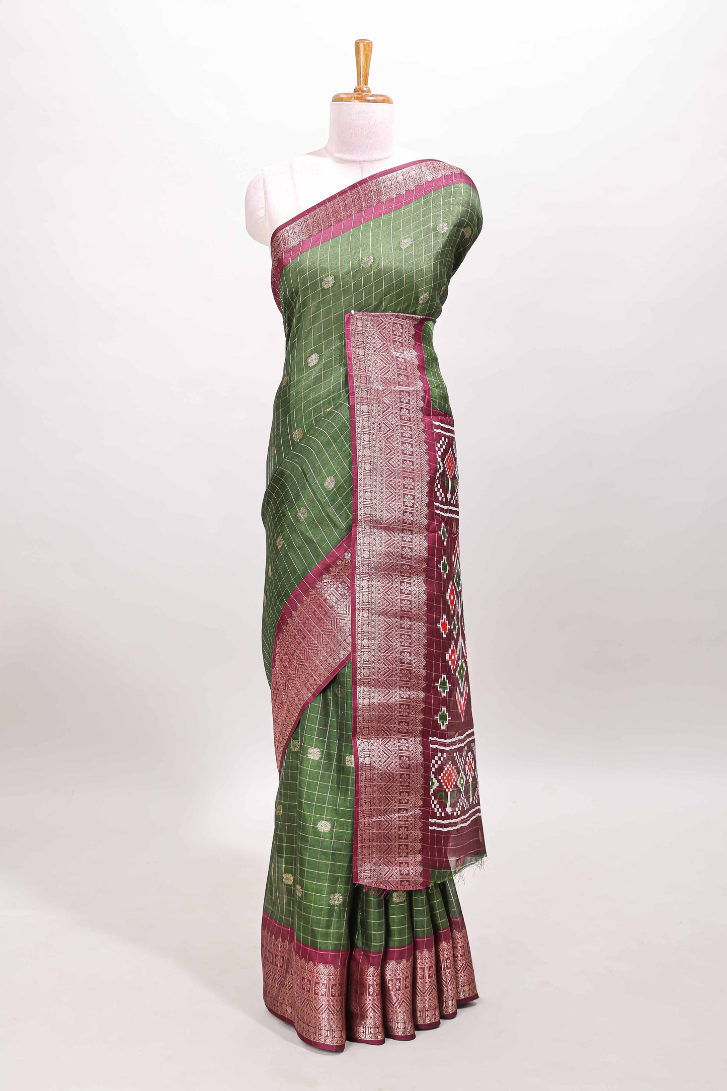 Green checked zari butta viscose dola silk saree with contrast zari border and ikkat style pallu
