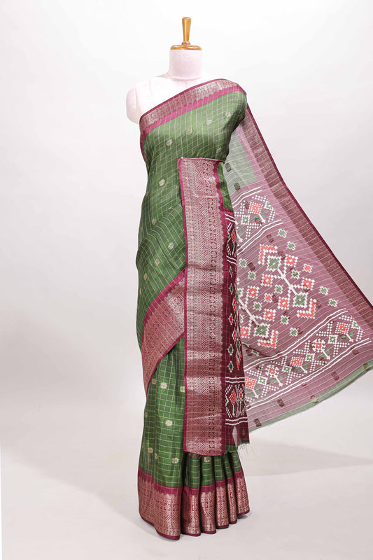 Green checked zari butta viscose dola silk saree with contrast zari border and ikkat style pallu