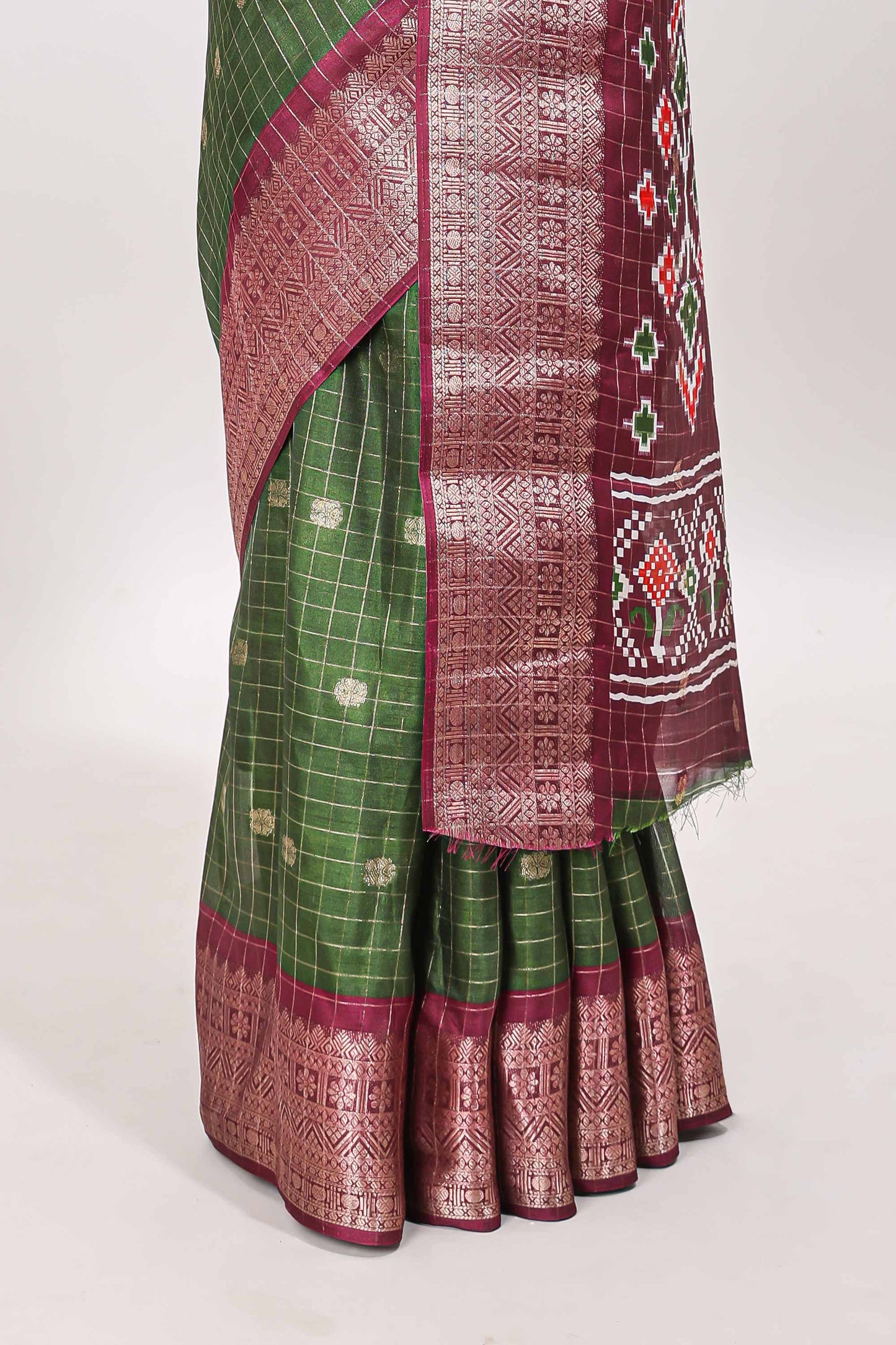 Green checked zari butta viscose dola silk saree with contrast zari border and ikkat style pallu