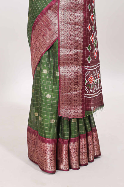 Green checked zari butta viscose dola silk saree with contrast zari border and ikkat style pallu
