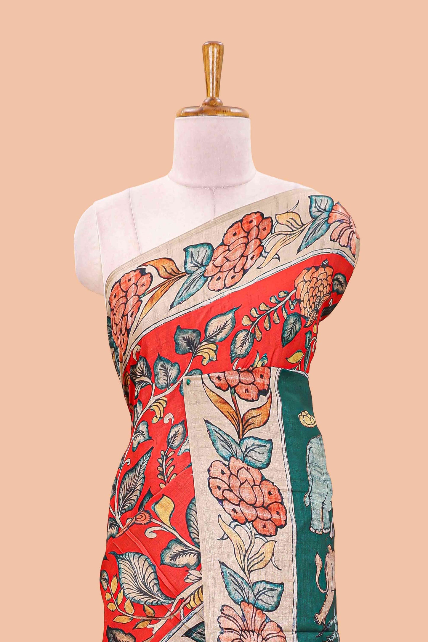 Red art tussar silk saree with leaf and floral printed body, cream border, and floral & animal print pallu