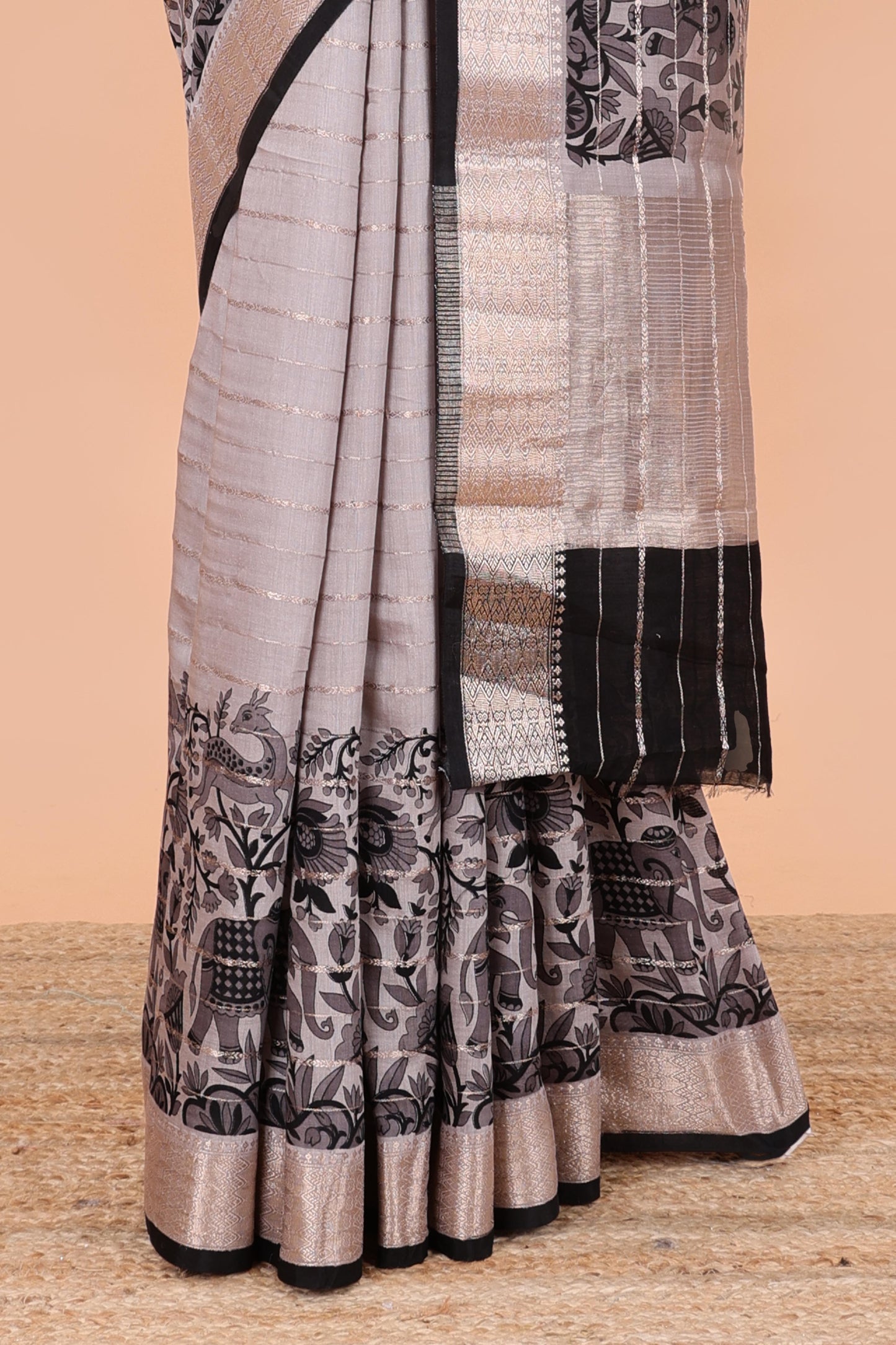 Grey striped assam silk saree with floral and animal themed contrast zari border and pallu