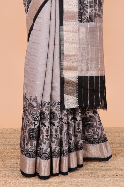 Grey striped assam silk saree with floral and animal themed contrast zari border and pallu