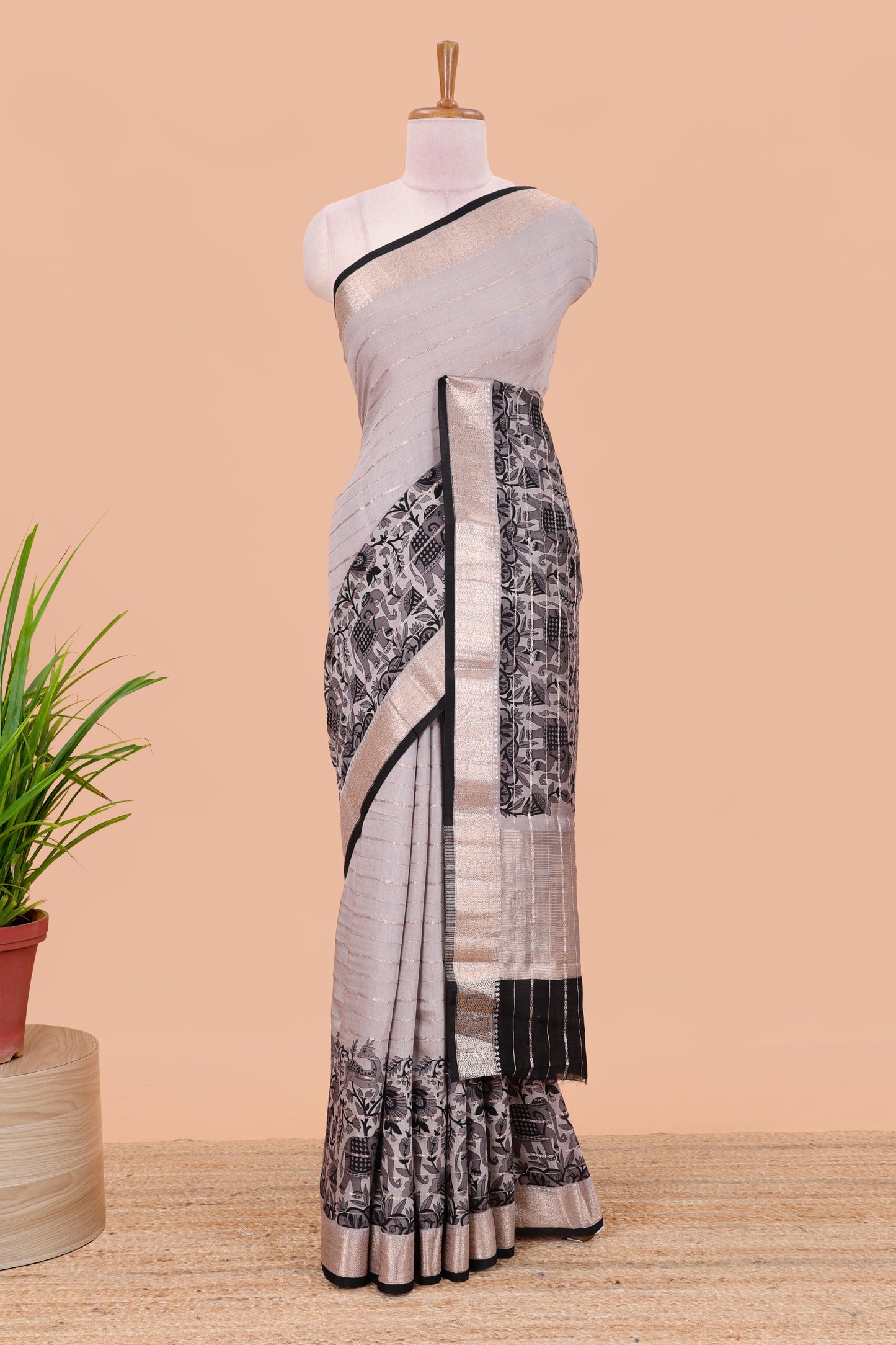 Grey striped assam silk saree with floral and animal themed contrast zari border and pallu