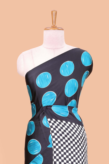 Black satin modal saree with blue polka print, contrast checked pallu, and printed blouse