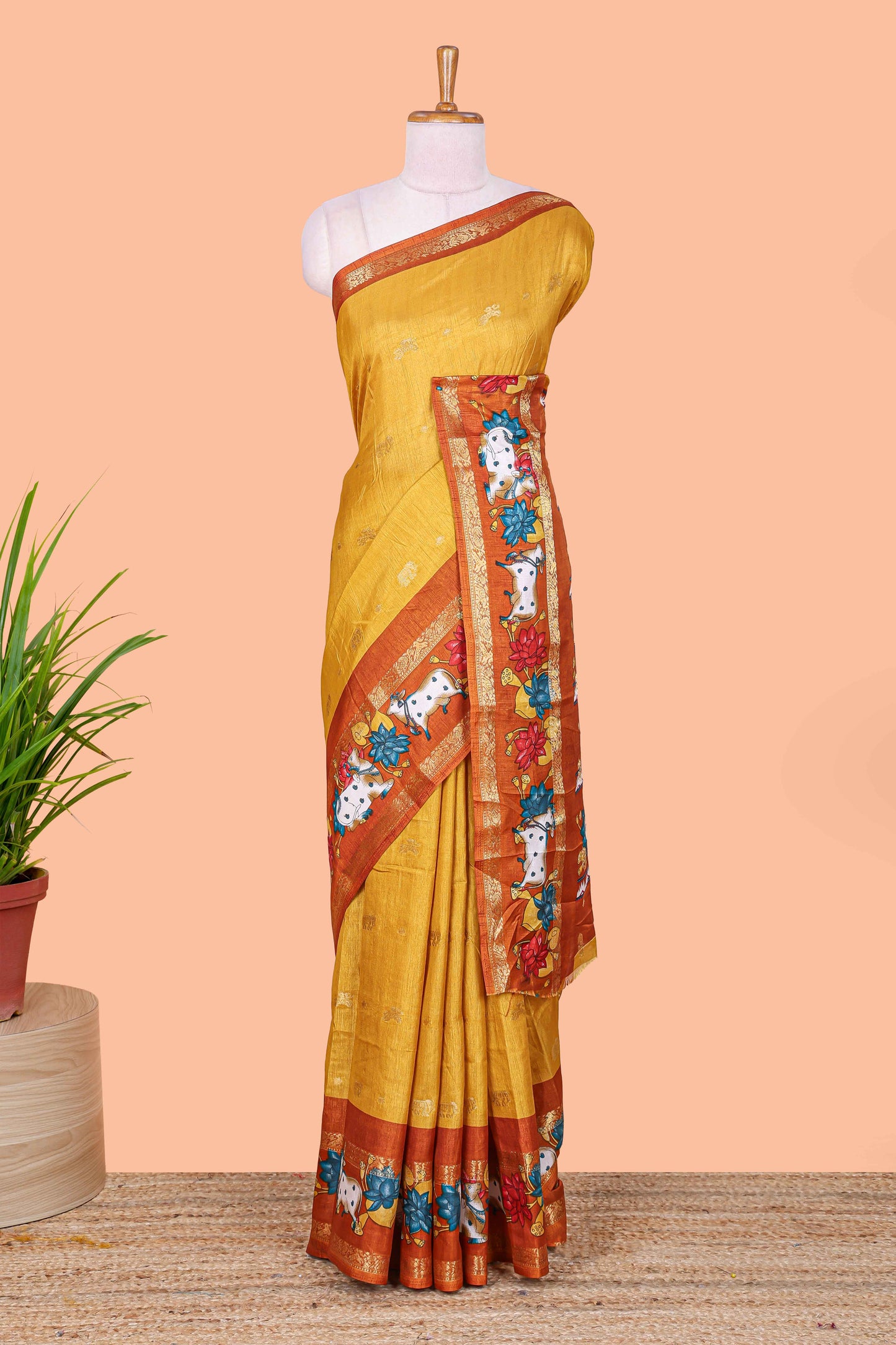 Mustard elephant zari butta art tussar silk saree with contrast pichwai cow double zari border