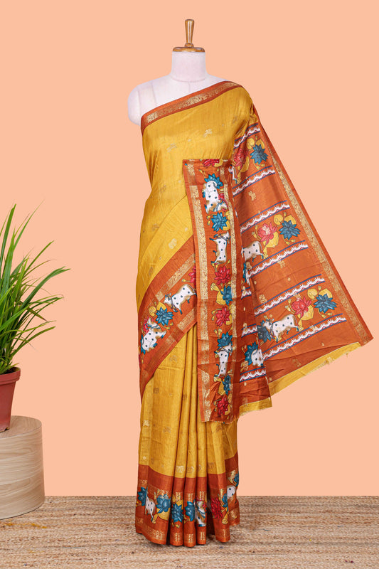 Mustard elephant zari butta art tussar silk saree with contrast pichwai cow double zari border