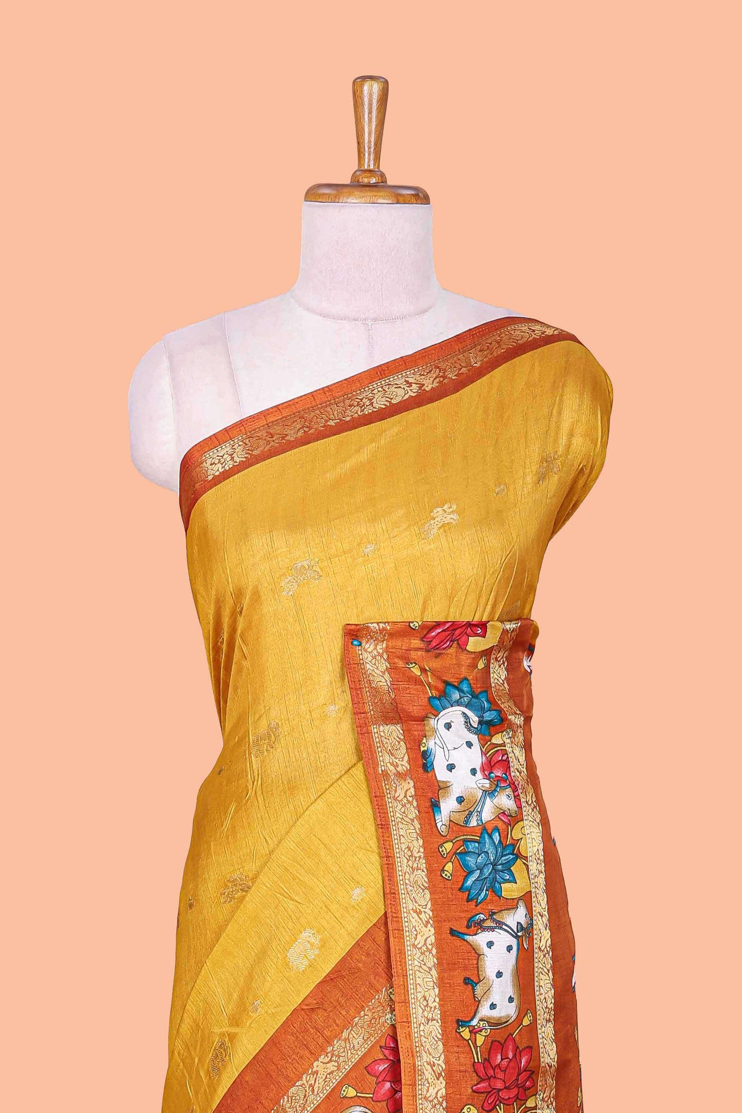 Mustard elephant zari butta art tussar silk saree with contrast pichwai cow double zari border