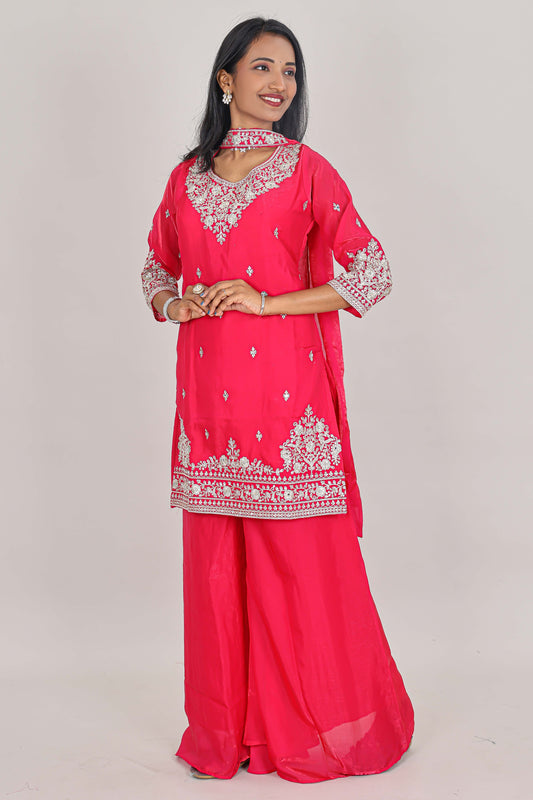 Pink floral butta stone work embroidered sharara set with 3/4 sleeves, U-neck matching bottom and dupatta