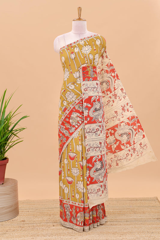 Mustard kalamkari printed cotton saree with traditional floral motifs and contrast pallu