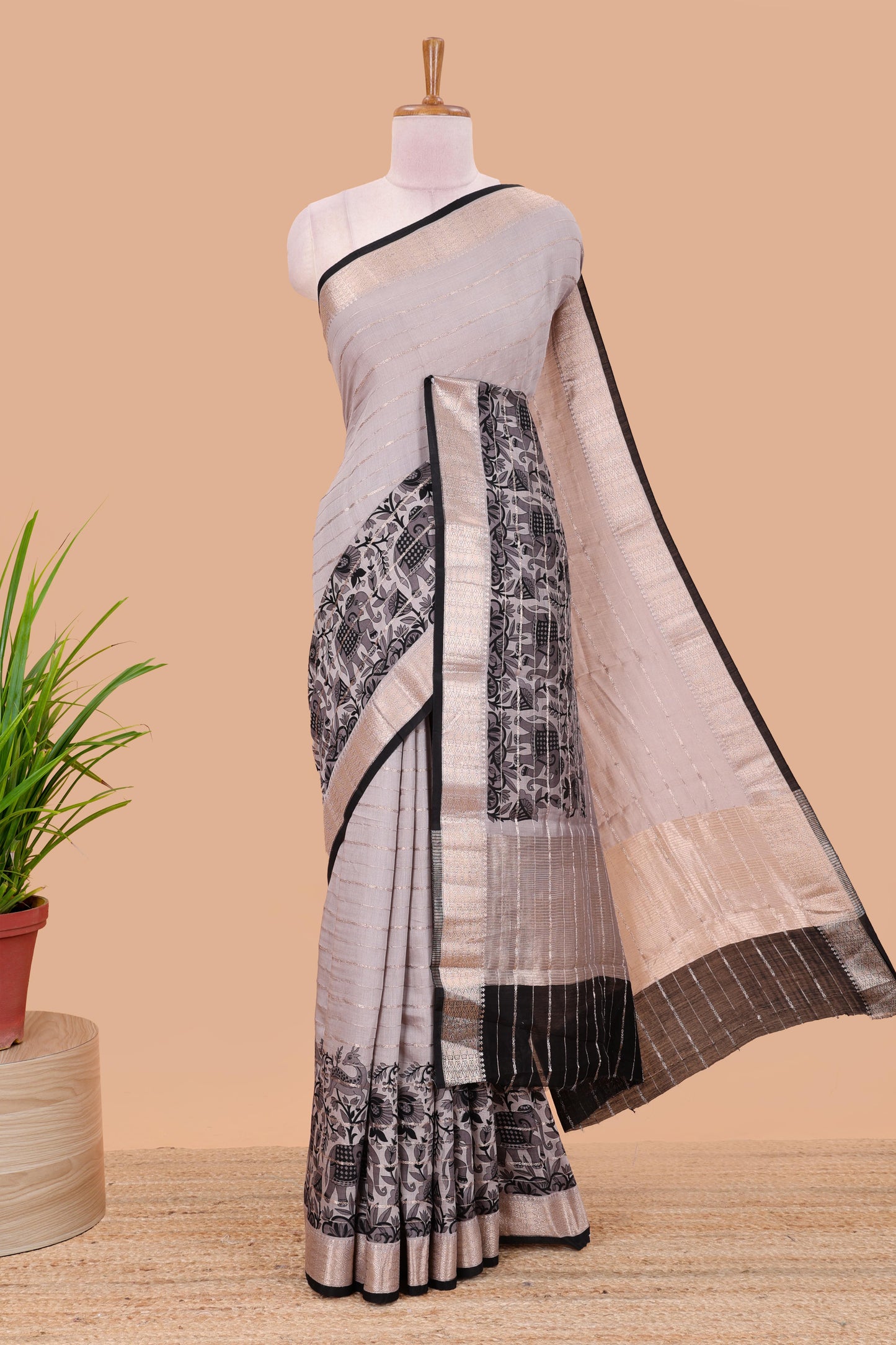 Grey striped assam silk saree with floral and animal themed contrast zari border and pallu