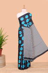 Black satin modal saree with blue polka print, contrast checked pallu, and printed blouse