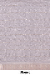 Grey striped assam silk saree with floral and animal themed contrast zari border and pallu