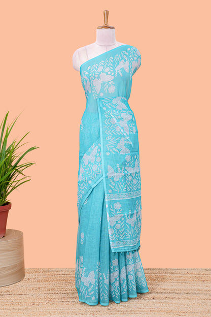 Turquoise green linen cotton saree with floral buttas and butterfly motifs border, Printed self pallu and blouse