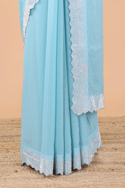 Blue designer georgette space silk saree with heavy stone and beads work, short pallu and contrast sequin embroidered blouse
