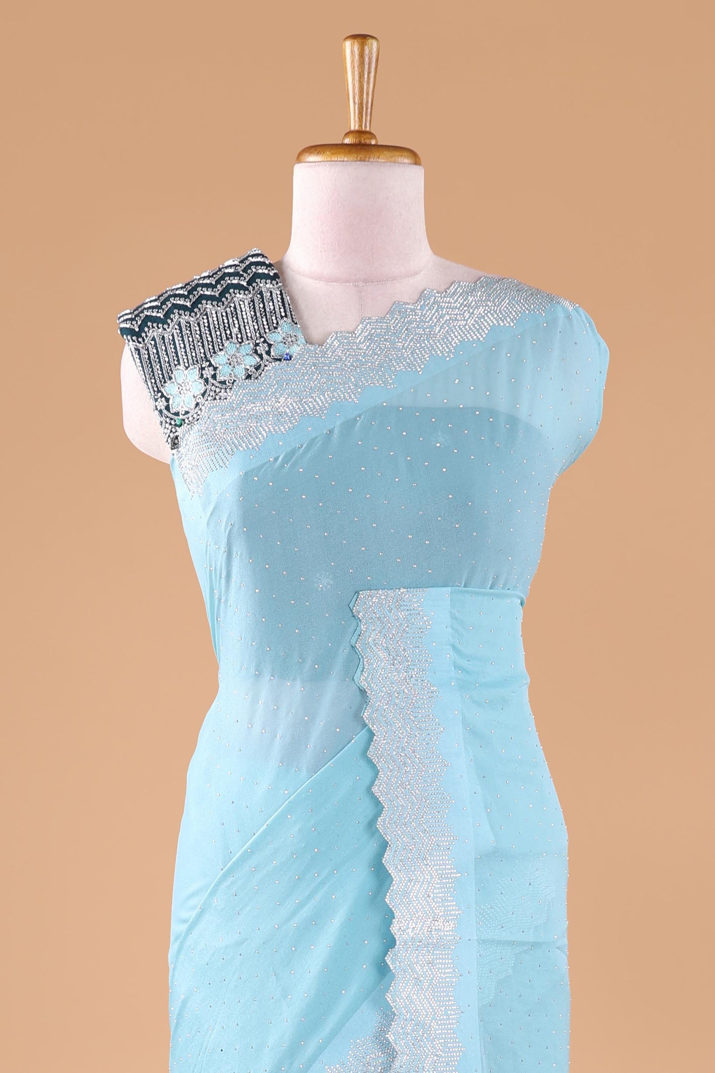 Blue designer georgette space silk saree with heavy stone and beads work, short pallu and contrast sequin embroidered blouse