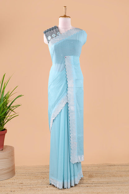 Blue designer georgette space silk saree with heavy stone and beads work, short pallu and contrast sequin embroidered blouse