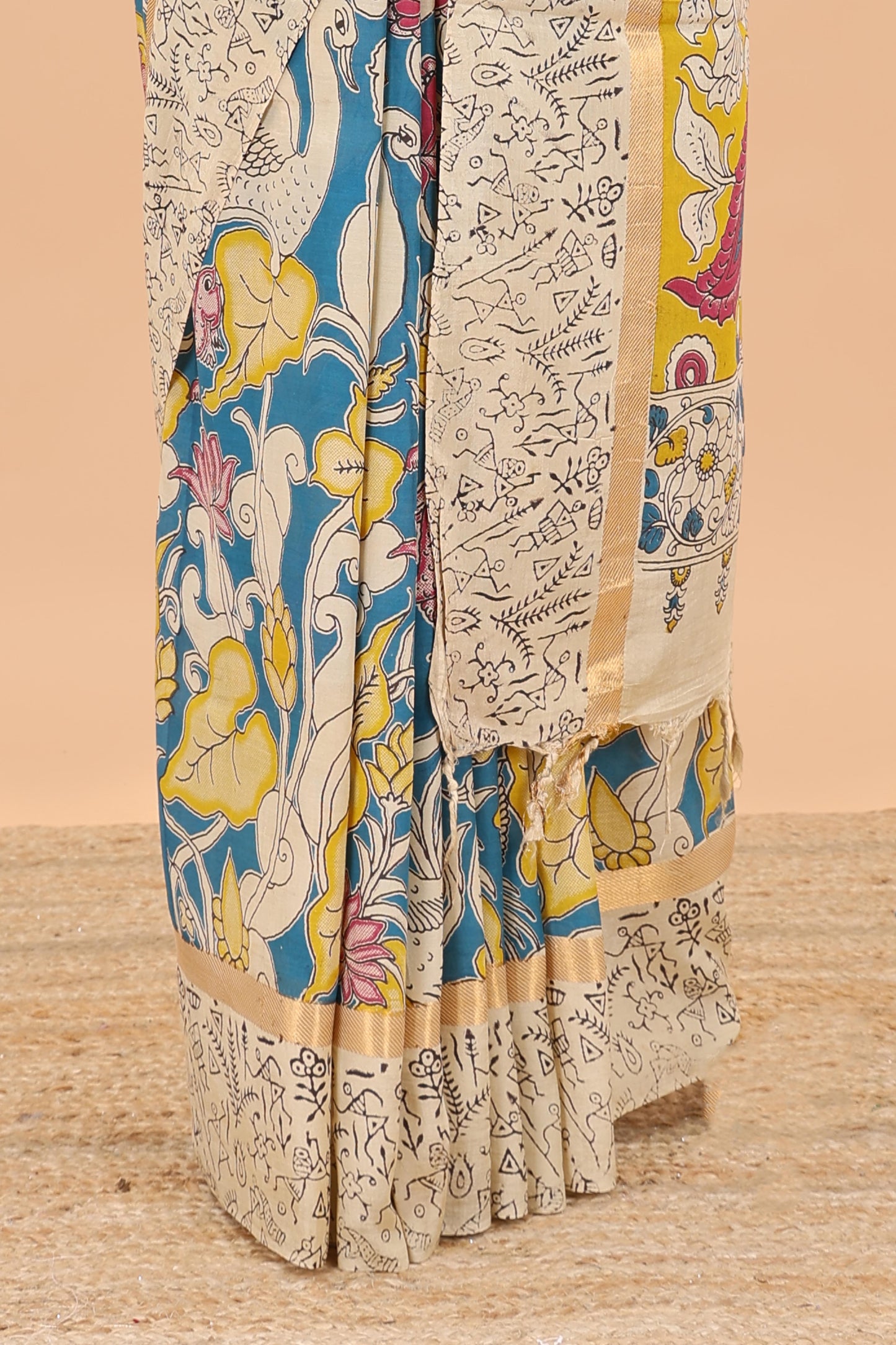 Peacock green kalamkari printed cotton saree with traditional floral motifs and contrast pallu