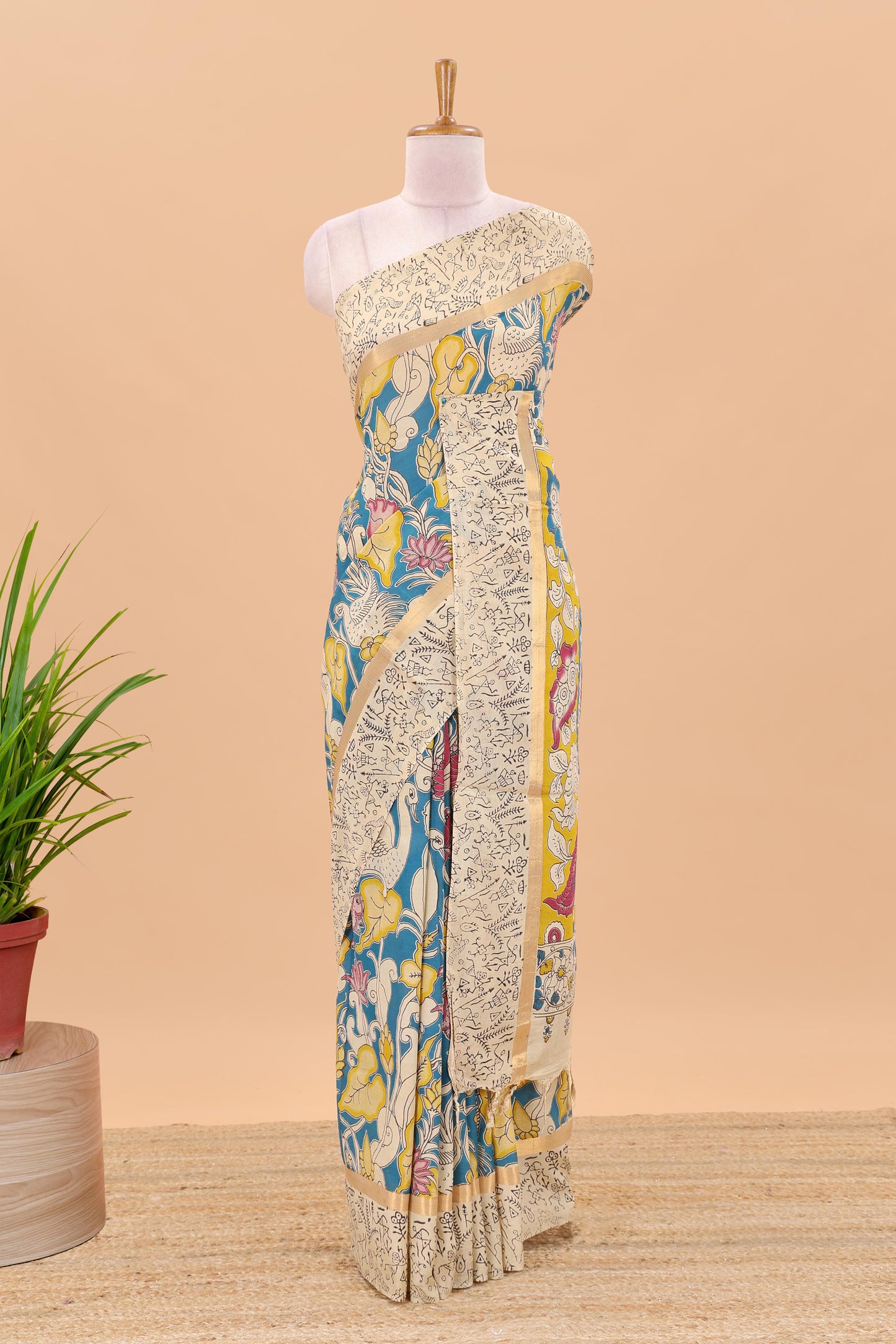 Peacock green kalamkari printed cotton saree with traditional floral motifs and contrast pallu