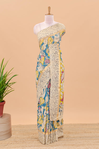 Peacock green kalamkari printed cotton saree with traditional floral motifs and contrast pallu