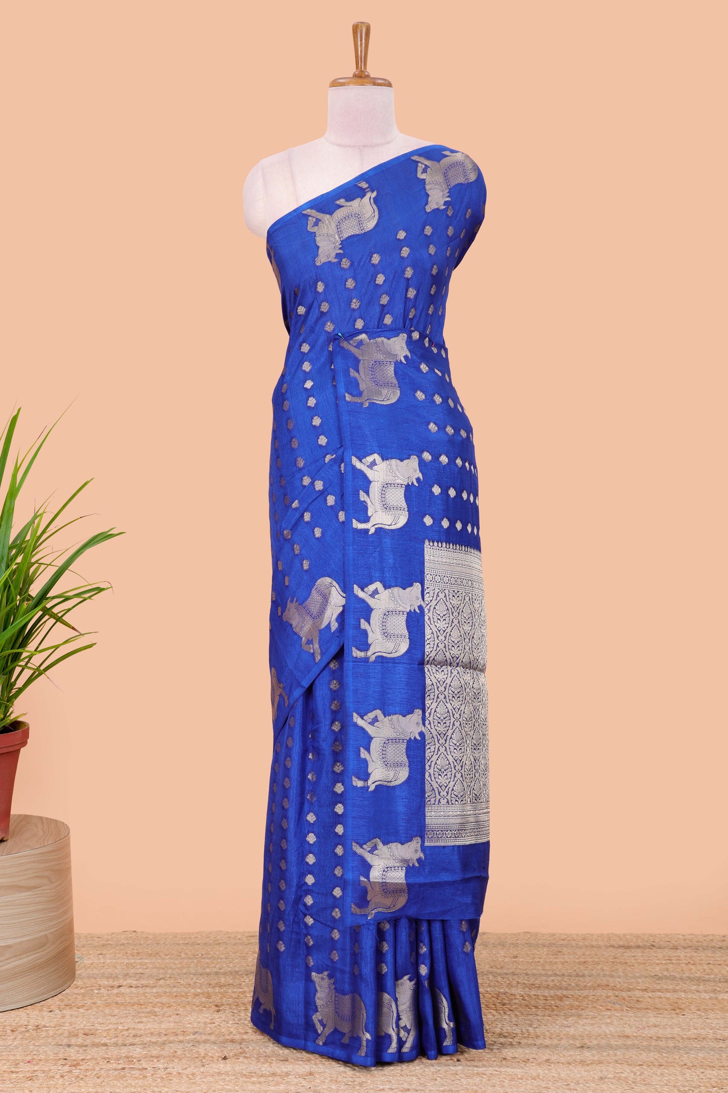 Blue viscose dola silk saree with zari butta weave, pichwai motif border and contrast blouse