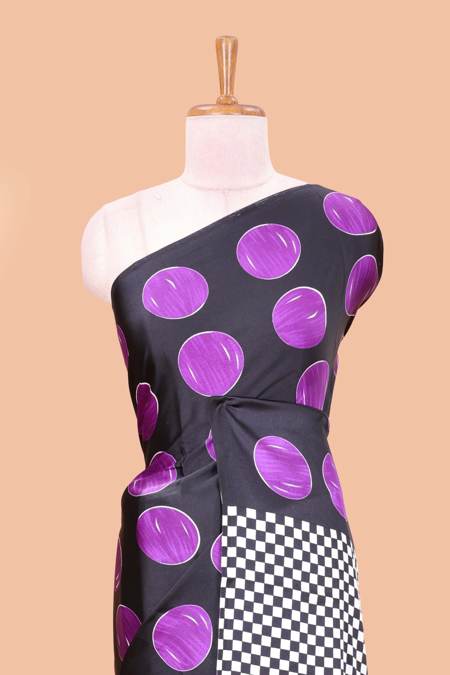 Black satin modal saree with purple polka print, contrast checked pallu, and printed blouse