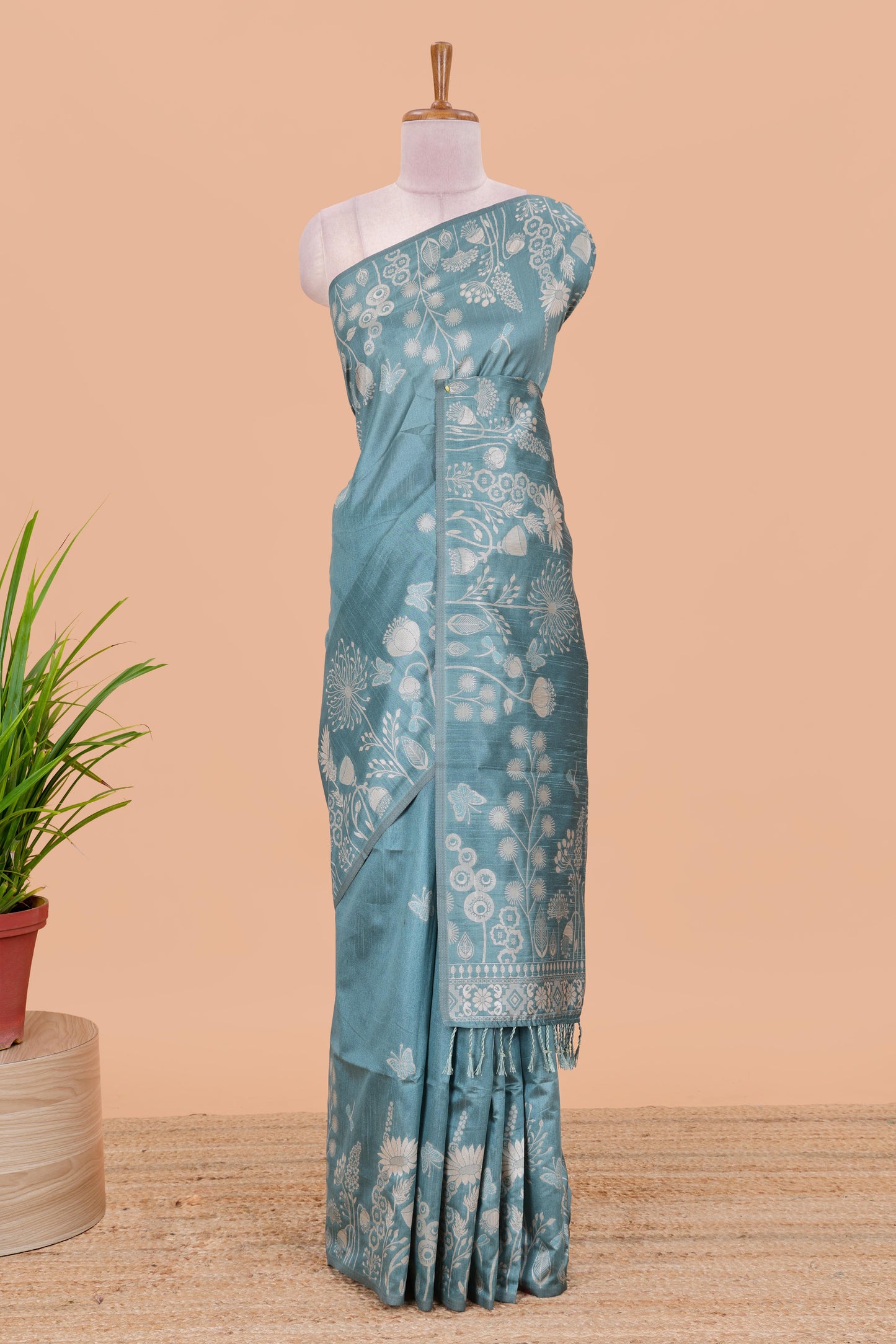 Blue munga cotton saree with all-over floral thread weaving & motif border