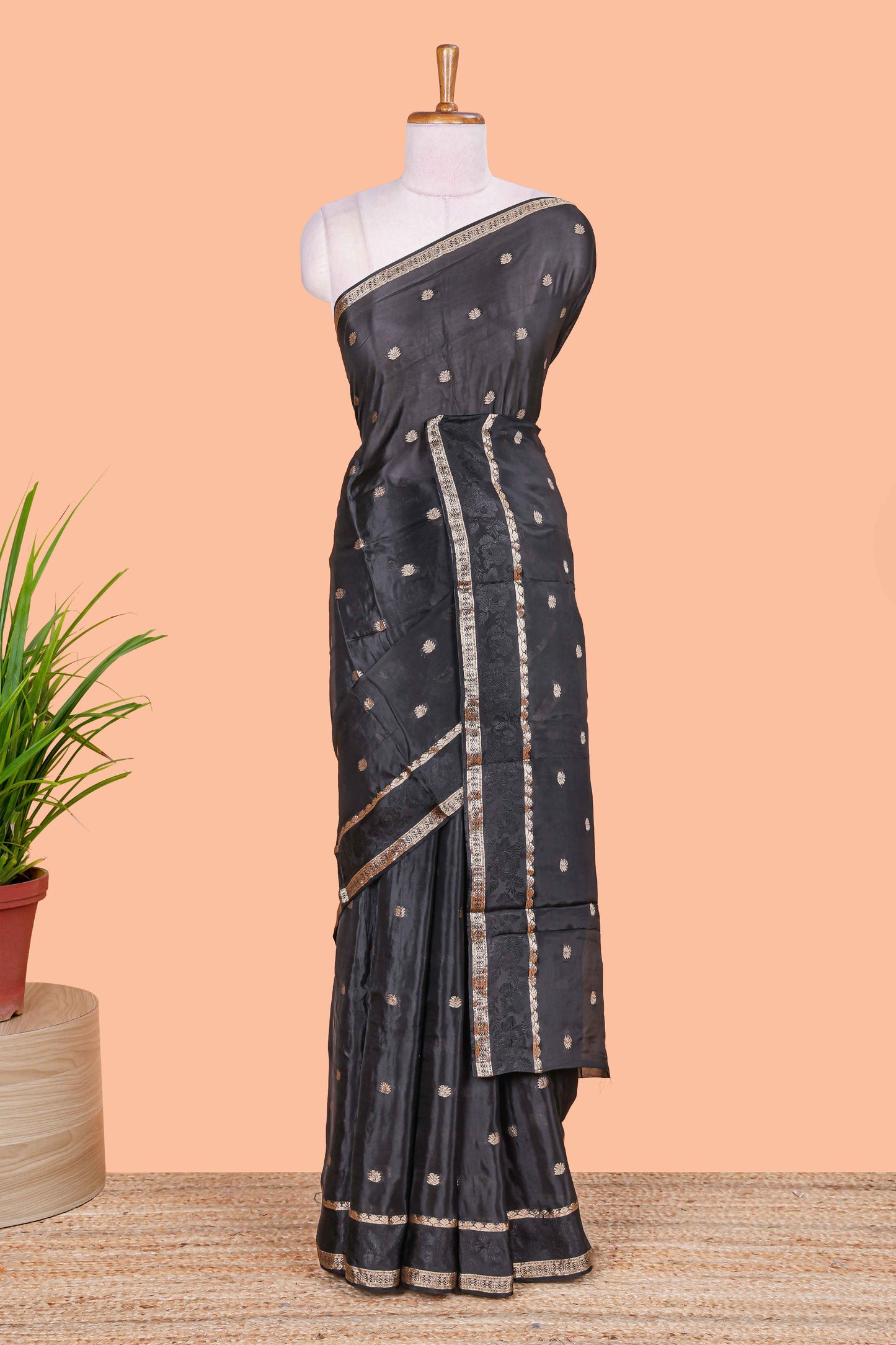 Black floral butta dola silk saree with self zari border and matching blouse