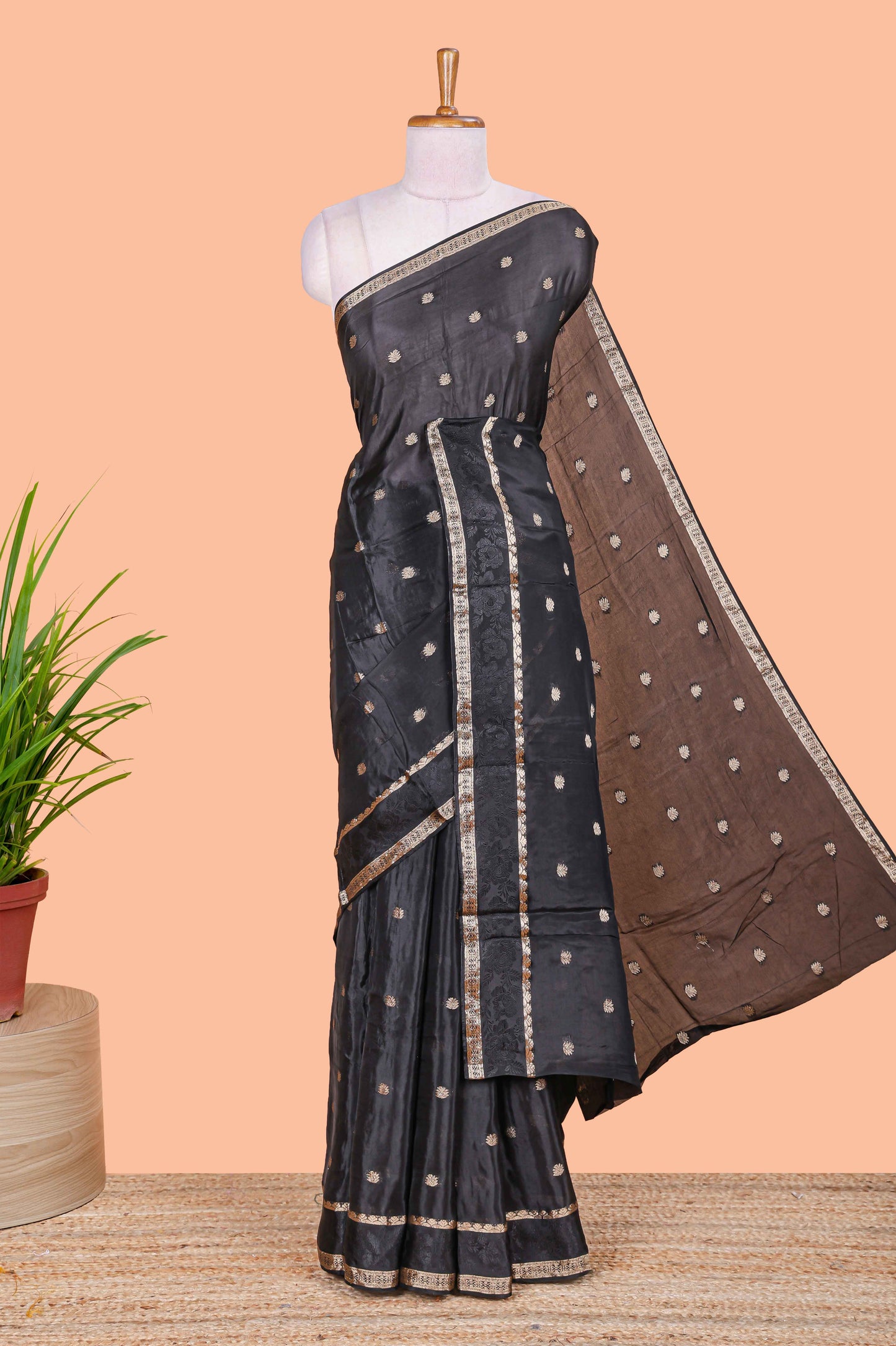 Black floral butta dola silk saree with self zari border and matching blouse