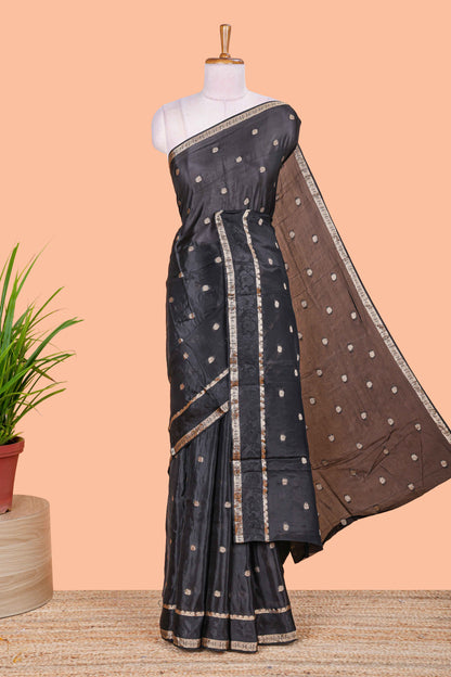 Black floral butta dola silk saree with self zari border and matching blouse
