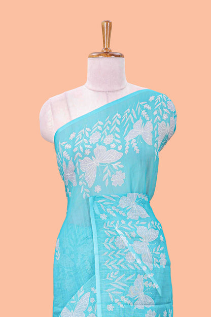 Turquoise green linen cotton saree with floral buttas and butterfly motifs border, Printed self pallu and blouse