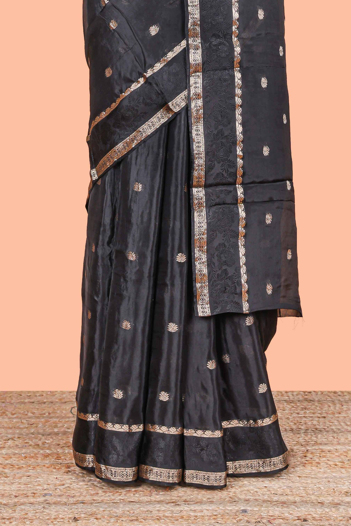 Black floral butta dola silk saree with self zari border and matching blouse