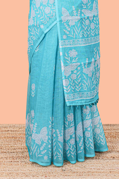 Turquoise green linen cotton saree with floral buttas and butterfly motifs border, Printed self pallu and blouse