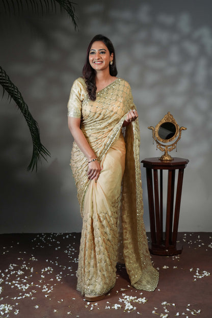 Green geometric pattern stone work all over body designer saree with scallop design border matching blouse