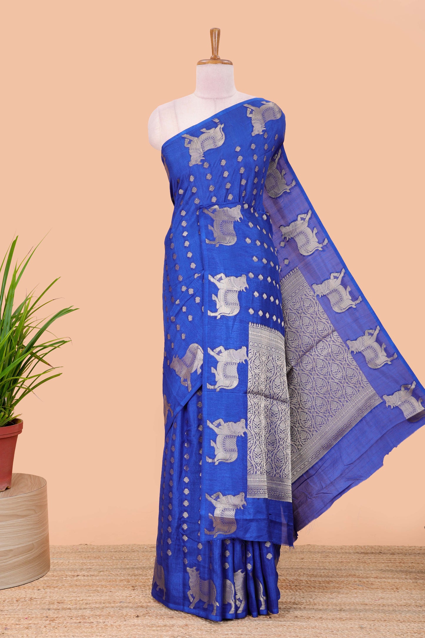 Blue viscose dola silk saree with zari butta weave, pichwai motif border and contrast blouse