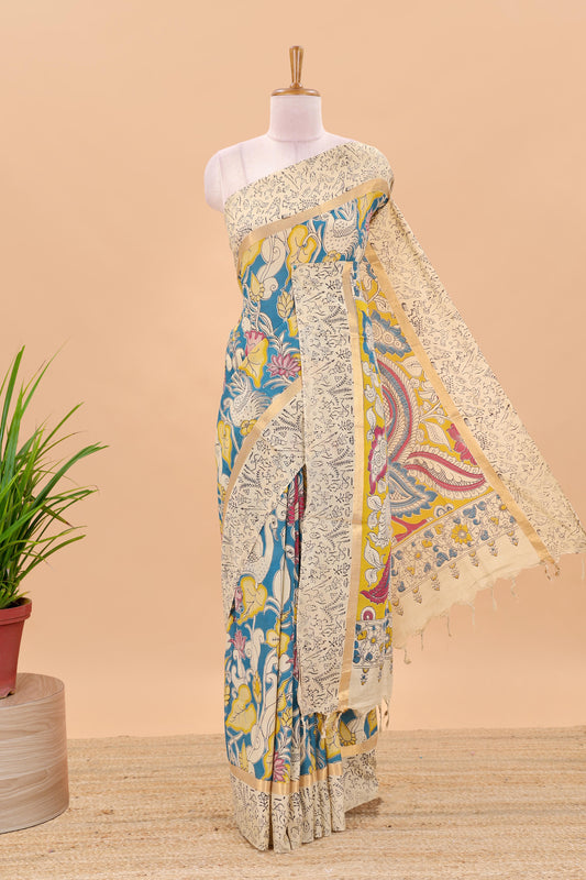 Peacock green kalamkari printed cotton saree with traditional floral motifs and contrast pallu