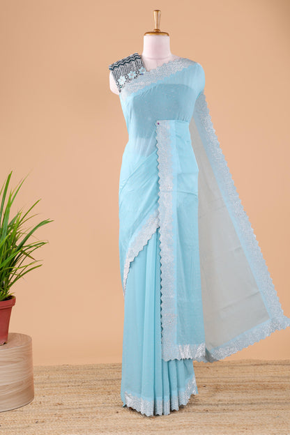 Blue designer georgette space silk saree with heavy stone and beads work, short pallu and contrast sequin embroidered blouse