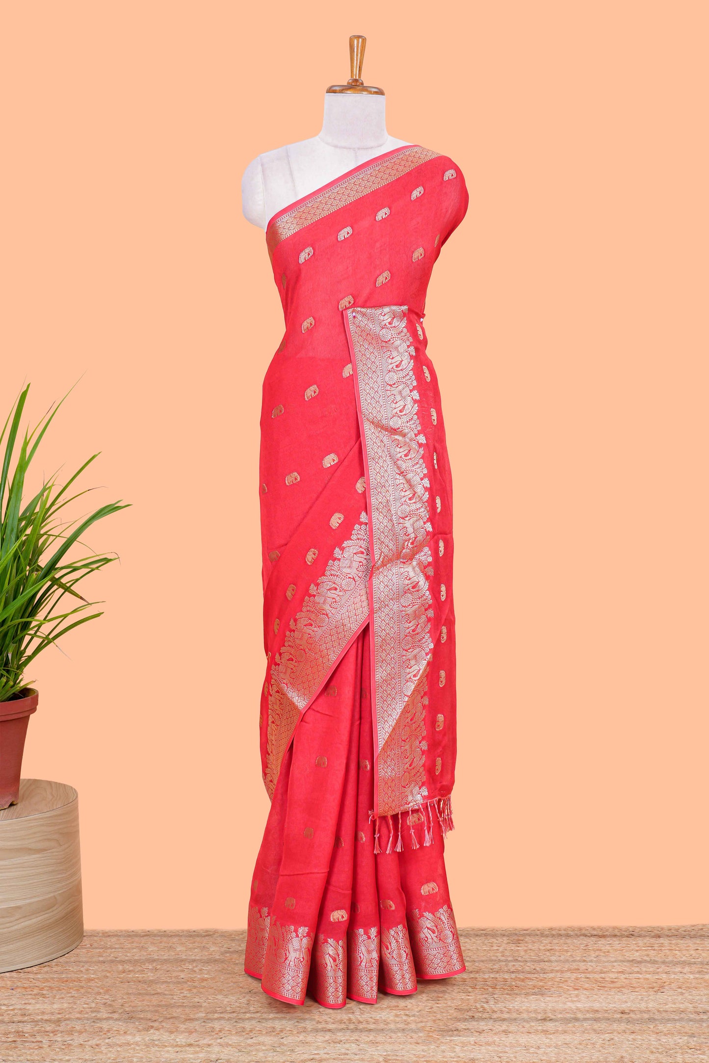 Orange marsh mallow saree with elephant butta and zari border, comes with contrast zari butta blouse