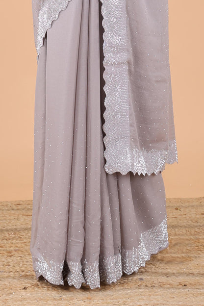 Grey designer georgette space silk saree with heavy stone & beads work, short pallu and contrast sequin embroidered blouse