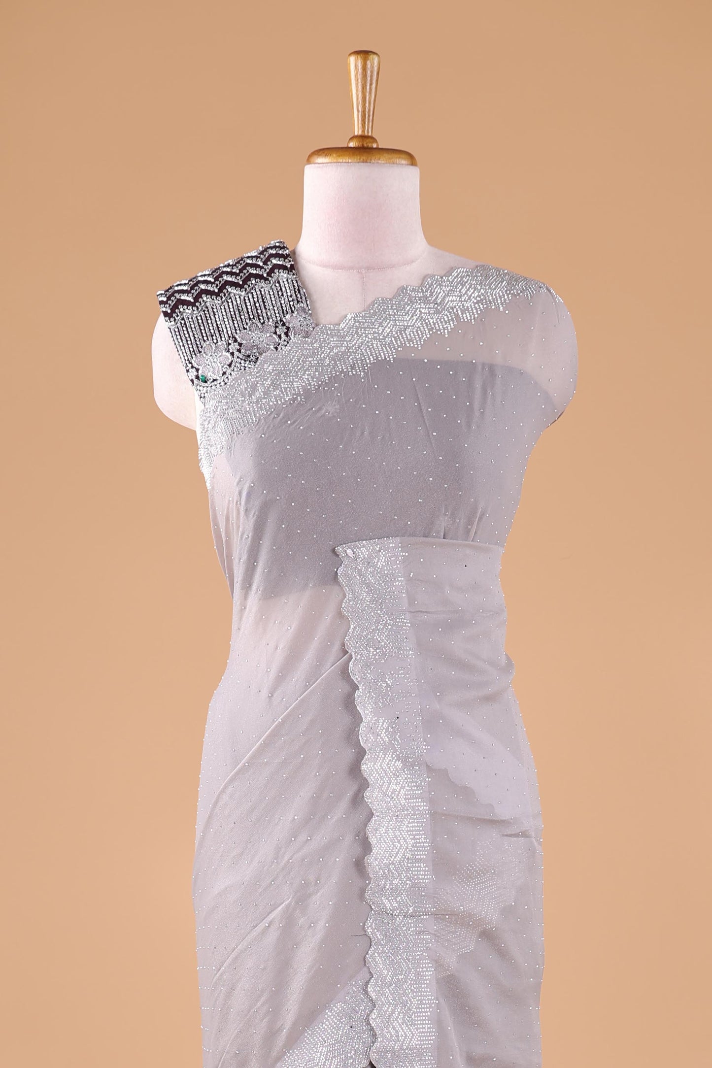 Grey designer georgette space silk saree with heavy stone & beads work, short pallu and contrast sequin embroidered blouse