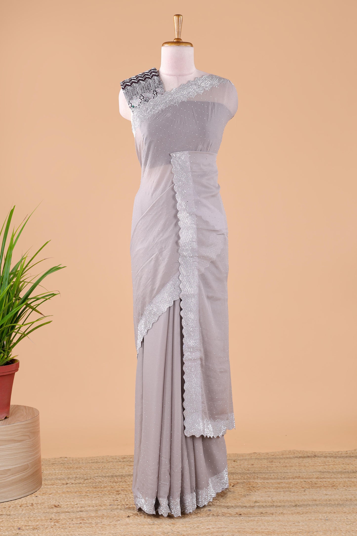 Grey designer georgette space silk saree with heavy stone & beads work, short pallu and contrast sequin embroidered blouse