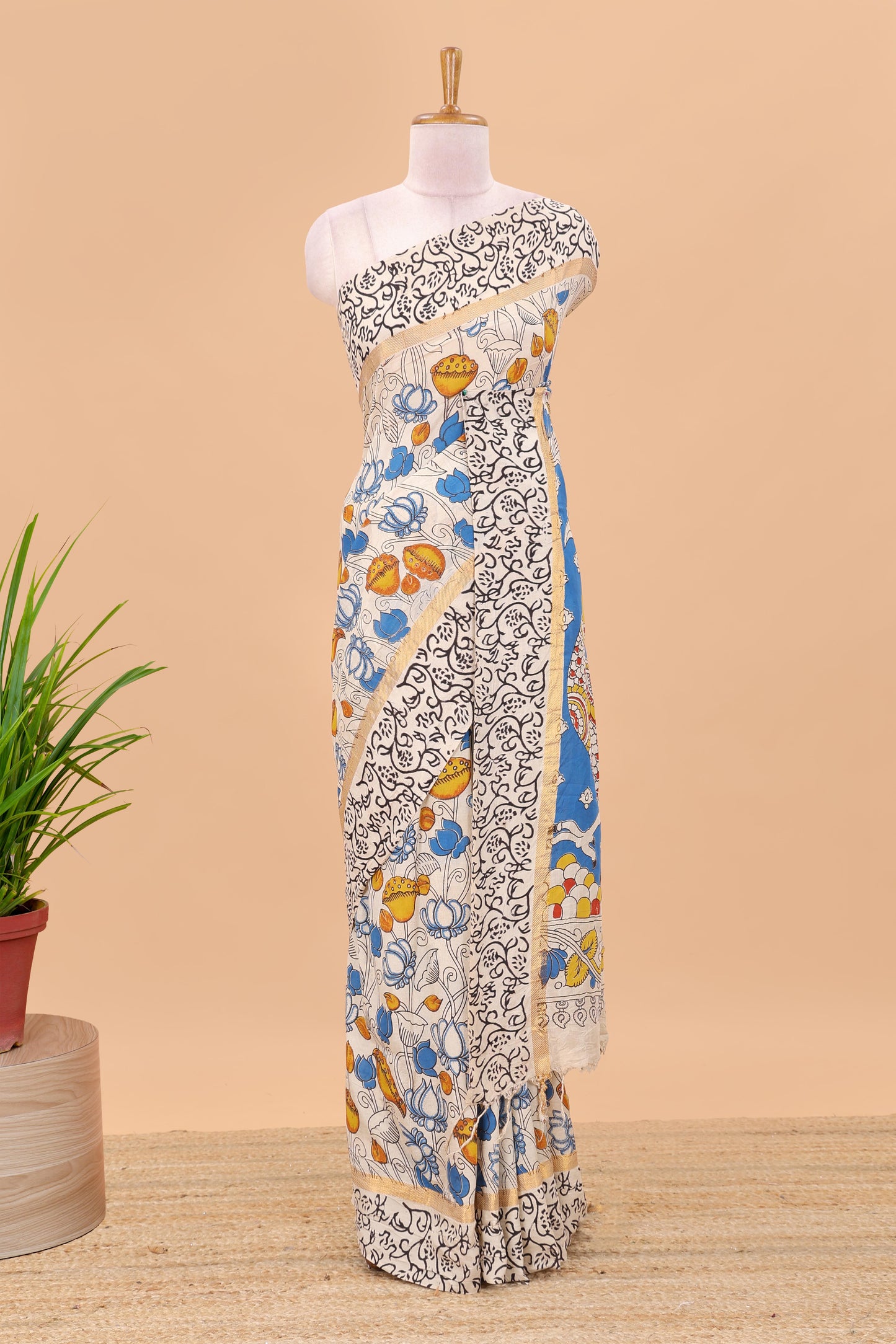 Sandal kalamkari printed cotton saree with traditional floral motifs and contrast pallu